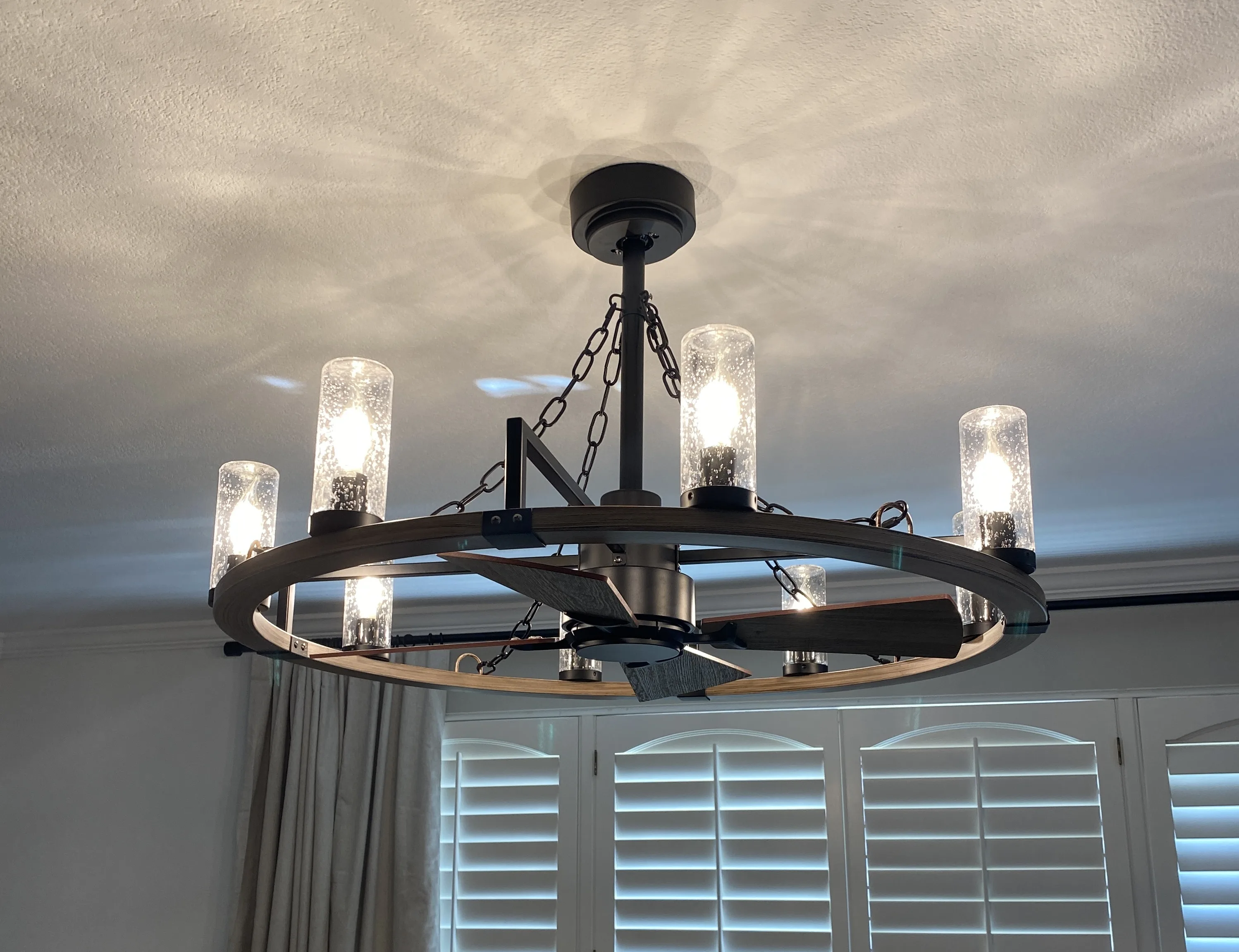 Wagon wheel chandelier installation Orange County CA