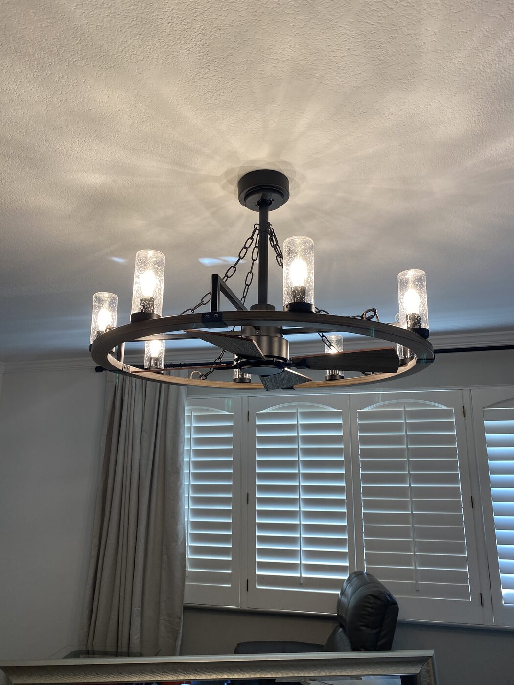 Wagon wheel chandelier installation