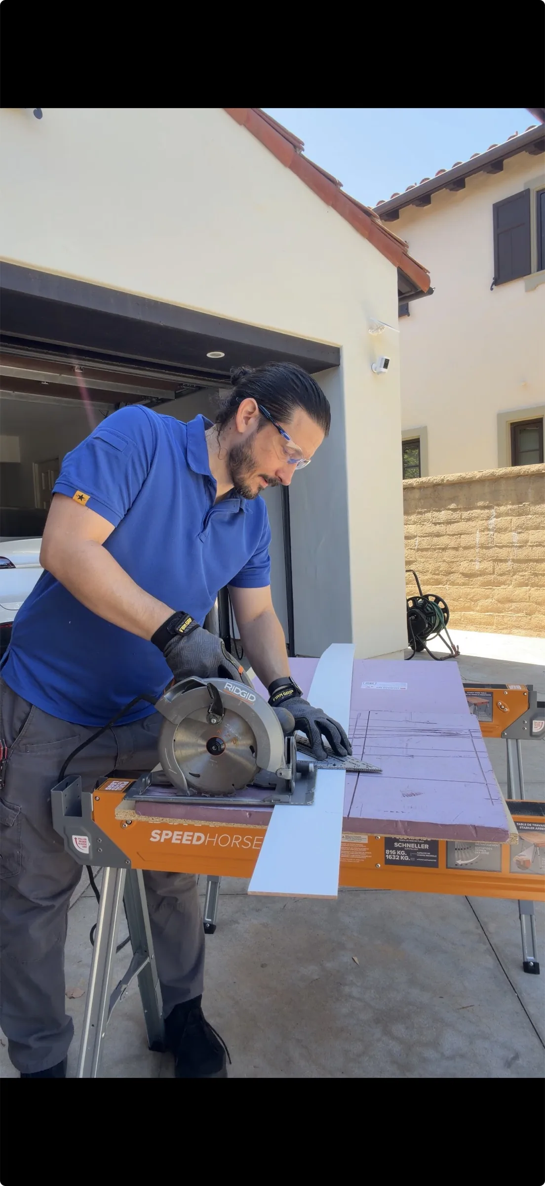 Dustin Swad of Ultra Home Repair cutting a board with a circular saw