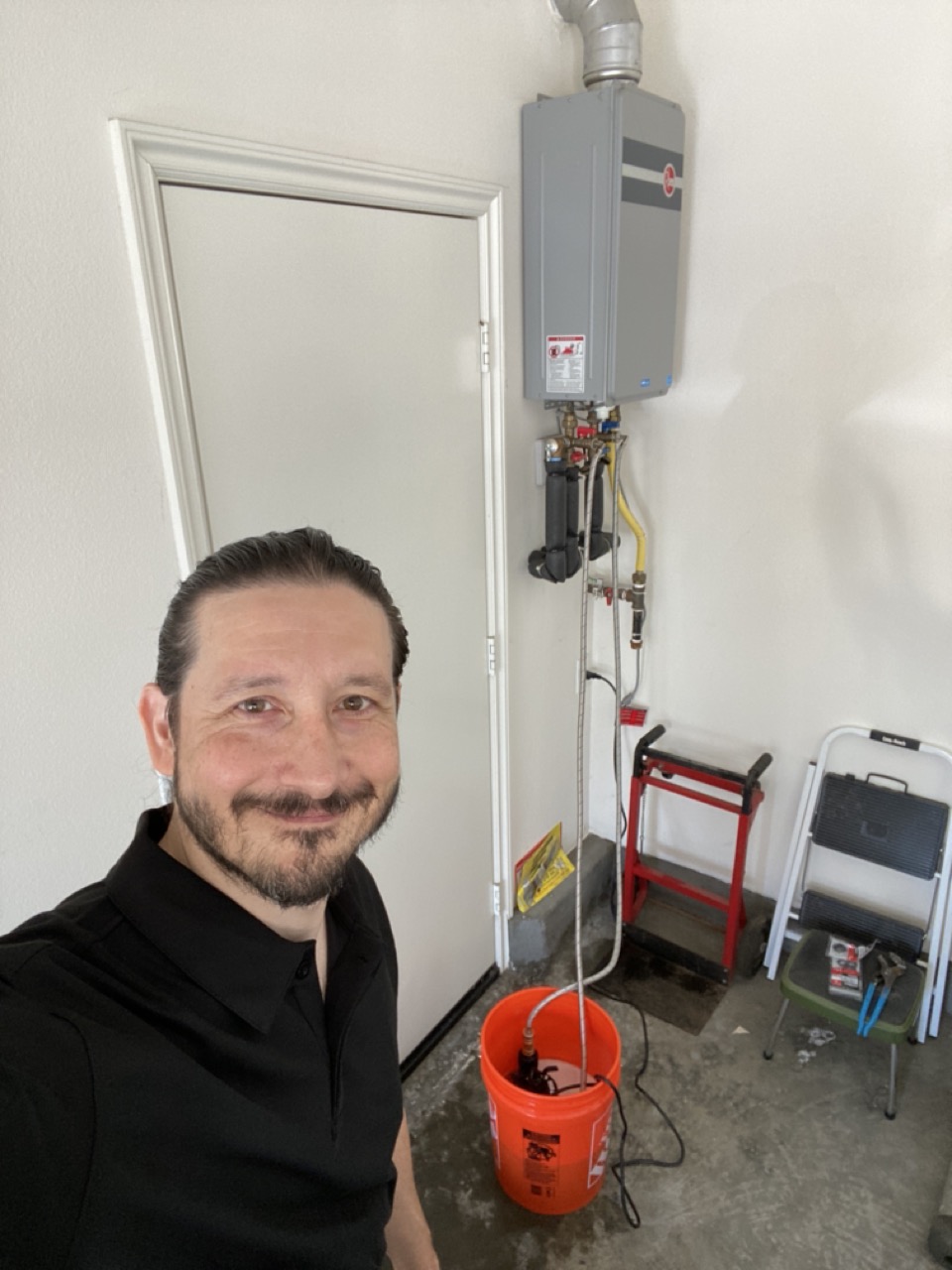 Tankless water heater during professional service in Irvine